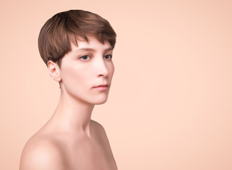 Beautiful woman. Female face close up. Portrait of young caucasian woman at studio isolated on pastel. Fresh skin and beauty concept. Short haircut, long neck, perfect skin