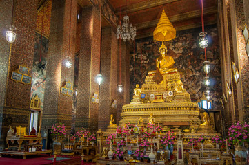 Fototapeta na wymiar The Principal Buddha Image of Phra Buddha Deva Patimakorn in the Main Chapel or Assembly Hall, Wat Pho, Bangkok, Thailand.