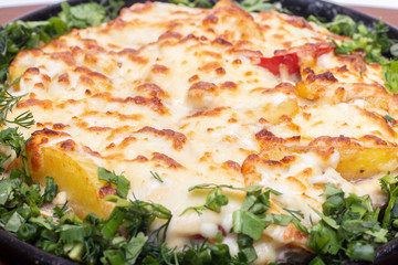 Skillet Strata with Bacon, Cheddar, Greens, Tomatoes and Potatoes