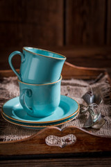 Closeup of blue coffee cup and on burlap napkin