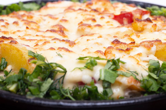 Skillet Strata with Bacon, Cheddar, Greens, Tomatoes and Potatoes