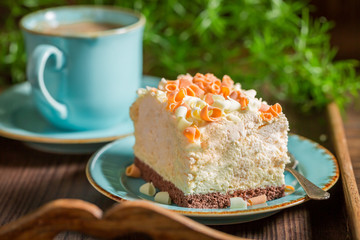 Closeup of meringue served in blue porcelain with coffee