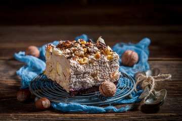 Closeup of homemade meringue with walnuts and chocolate
