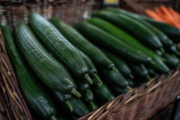 fresh green cucumbers in a wicker net