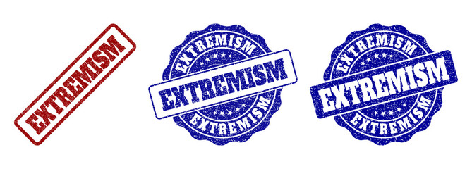 EXTREMISM scratched stamp seals in red and blue colors. Vector EXTREMISM marks with grunge style. Graphic elements are rounded rectangles, rosettes, circles and text titles.