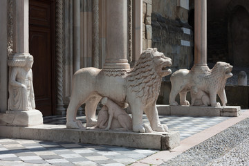 Lions supporting the columns porch, Upper town of Bergamo, Italy
