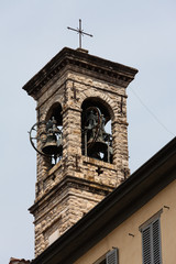Fototapeta na wymiar Belfry with cross, Upper town of Bergamo, Italy