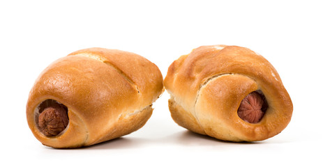 cut sausage in dough on white background