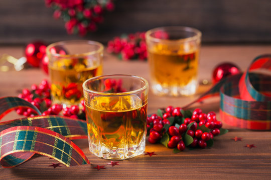 Whiskey, brandy or liquor shot and Christmas decorations