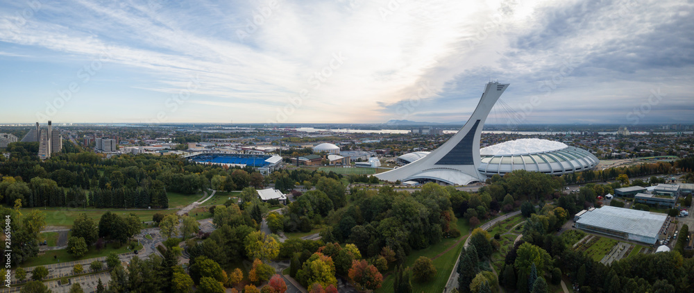 Wall mural aerial panoramic view of a modern cityscape during a vibrant day during fall season. taken in montre