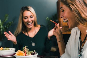 Vegetarian Restaurant. Cheerful Female Friends Rejoicing At Fresh Salad.