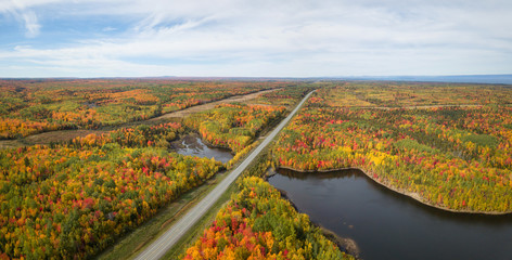 Aerial panoramic view of highway in a beautiful Canadian Landscape during fall color season. Taken...