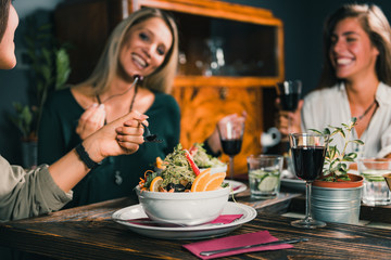 Vegetarian Restaurant. Female Friends In A Vegetarian Restaurant