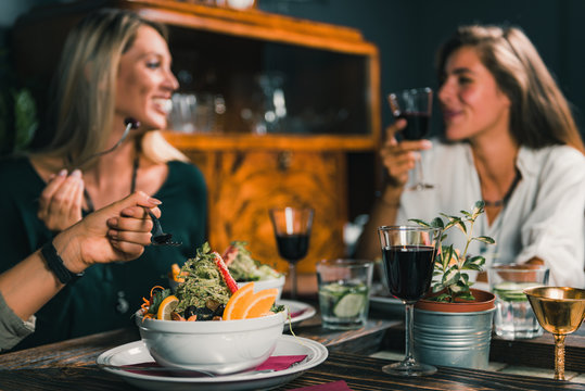 Vegetarian Restaurant. Female Friends In A Vegetarian Restaurant