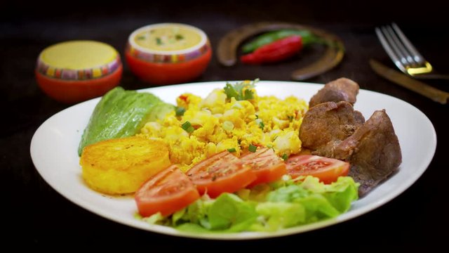 Ecuadorian Fritada with mote pillo and salad