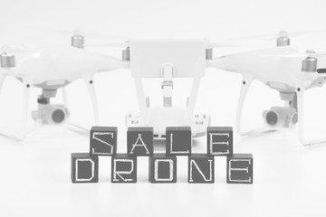 Flying drones on a white background with inscriptions 