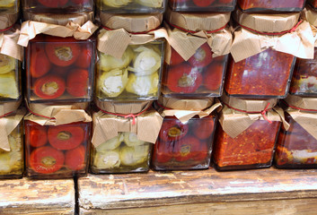 glass jars with Calabrian specialties such as spicy peppers arti