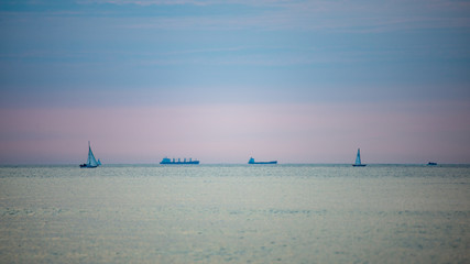 Obraz premium calm blue sunset over clear water in baltic sea