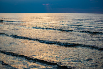 calm blue sunset over clear water in baltic sea
