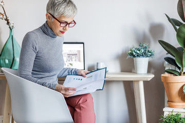 Businesswoman Analysing Documents