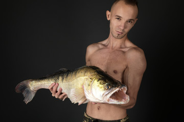 Fishing. Fisherman and trophy Zander