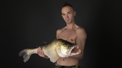 Fishing. Fisherman and trophy Zander