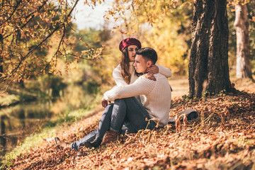 Amorous couple enjoying autumn day outdoors