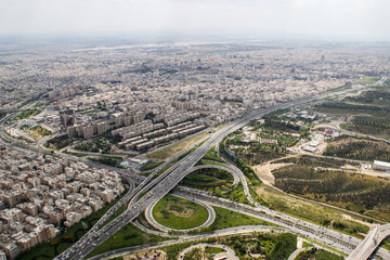 Top view of Iranian capital Tehran. Megapolis with road junctions