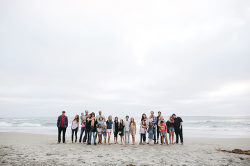 Multigenerational family portrait on the beach.