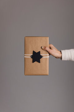 Hand hols a package