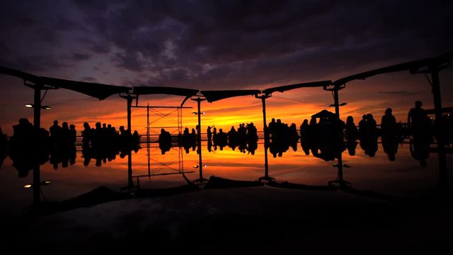 Tourists viewing the sunset at the Larcomar Metropolitan shopping Centre complex Miraflores district Lima Peru South America 