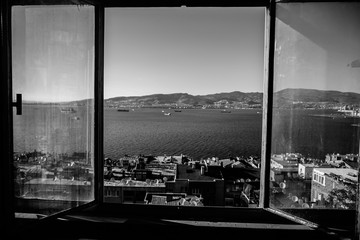City landscape of Izmir from wooden windows. Smyrna, Aegean sea, Turkey.