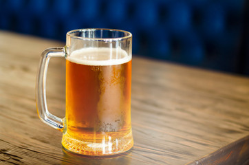 a glass of light wheaten beer and fried peanuts. pints of beer. beer party. holiday with friends