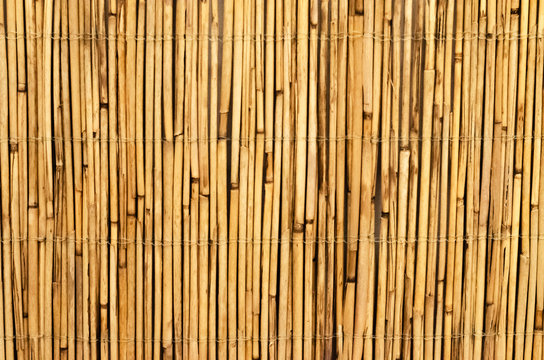 fence of straw. loft design. bamboo wood background