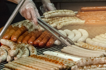 Cooking of sausages on the grill. LotusGrill. Barbecue grill. charcoal grill