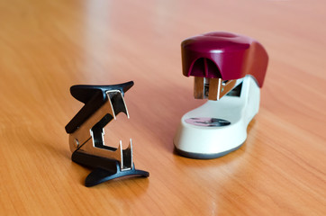 Staple remover and stapler on the table. stationery set. office trivia