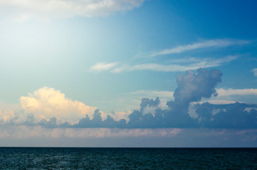 Naklejka na ściany i meble magic blue sky over the sea coast. beautiful sky. colored clouds