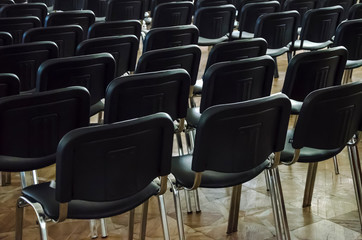 rows of chairs in auditorium