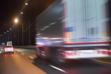 truck moves on highway at night