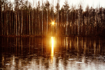 Sunset sun is reflected in the river water