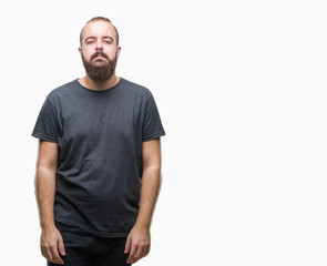 Obraz premium Young caucasian hipster man over isolated background with serious expression on face. Simple and natural looking at the camera.