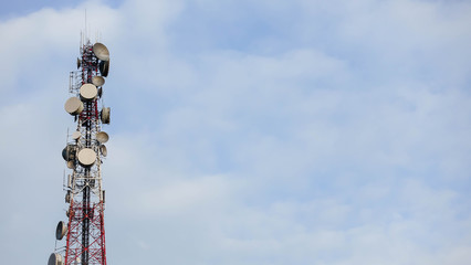 Telecommunications tower, Telecommunication mast TV antennas wireless system technology with cloudy blue sky, 
