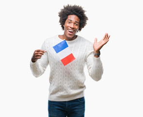 Afro american man flag of France over isolated background very happy and excited, winner expression celebrating victory screaming with big smile and raised hands