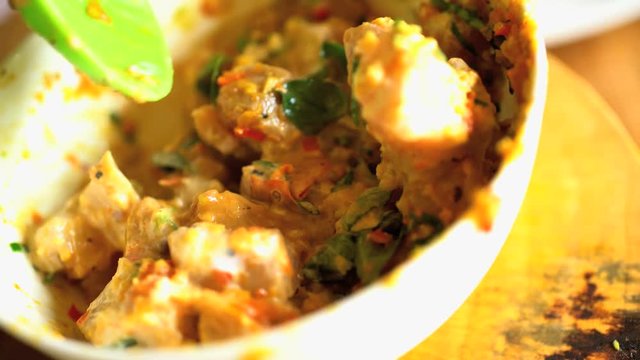 Healthy white Mahi Mahi fish local to Bali chopped uncooked and skinless in bowl with Basa gede