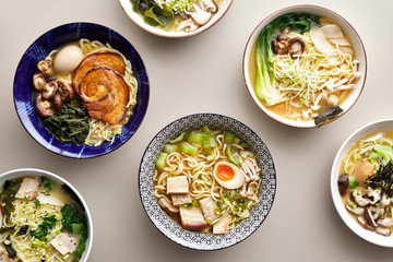 Different types of ramen in bowls.