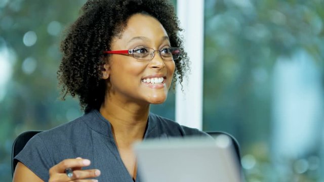 Attractive ethnic female business financial advisor leading meeting in boardroom 