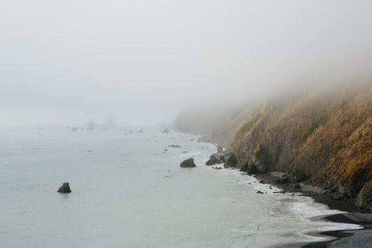 View of Mendocino coastline and heavy fog, California