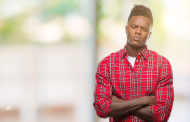 Obraz premium Young african american man over isolated background skeptic and nervous, disapproving expression on face with crossed arms. Negative person.