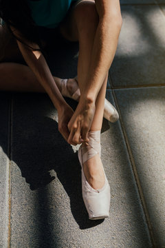 Crop Ballerina Tying Pointe Shoes