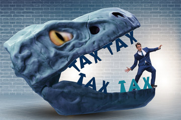 Businessman in the jaws of high taxes